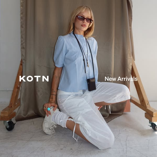 This ad features a woman kneeling in front of a backdrop, showcasing new arrivals from the clothing brand KOTN.