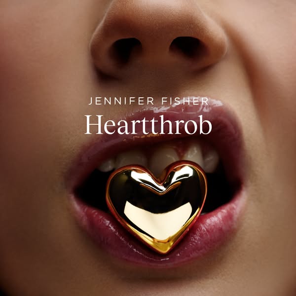This image ad features a close-up of a person's mouth with a gold heart-shaped object between their lips. The ad pro