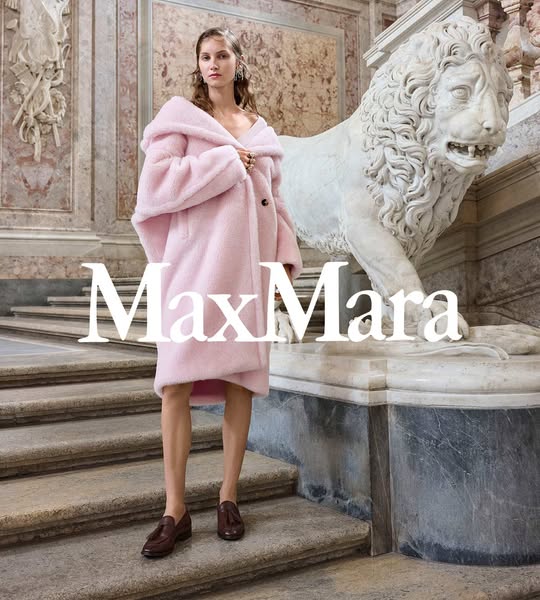 This ad showcases a woman wearing a pink Max Mara coat in a luxurious setting. The ad focuses on the coat's design a
