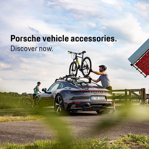 This ad showcases Porsche vehicle accessories, specifically a bike rack, with an active couple seen cycling in the backg