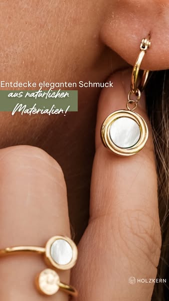 This ad showcases elegant jewelry made from natural materials. It features a close-up of a woman's ear wearing a gol