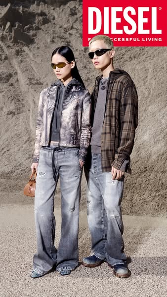 This ad features a modern street-style editorial shot of 2 models wearing Diesel brand clothing, including jeans, outerw