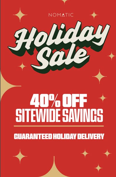 This image ad promotes a holiday sale from Nomatic, offering 40% off sitewide with guaranteed holiday delivery. The desi