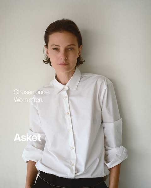This ad features a model wearing a white, button-down shirt from Asket and emphasizes the brand's focus on timeless,