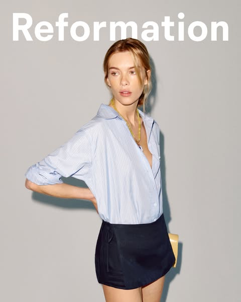 An ad for Reformation featuring a person wearing a blue and white striped shirt and a black wrap skirt. The brand name i