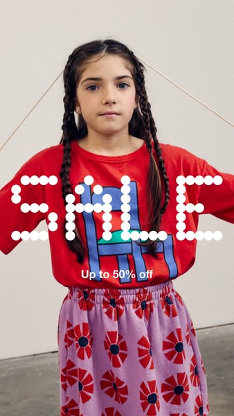 This image ad promotes a sale of up to 50% off on children's clothing. The ad features a young girl wearing a red sh