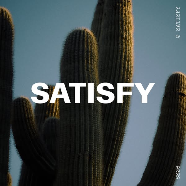This ad for Satisfy running apparel features an close up photo of a Saguaro cactus in front of a blue sky. The brand nam