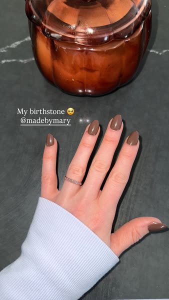 This ad features a hand with a ring and a fresh manicure. The ad is promoting the brand Made by Mary.