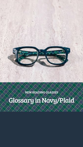 This image ad showcases a pair of navy and plaid reading glasses.