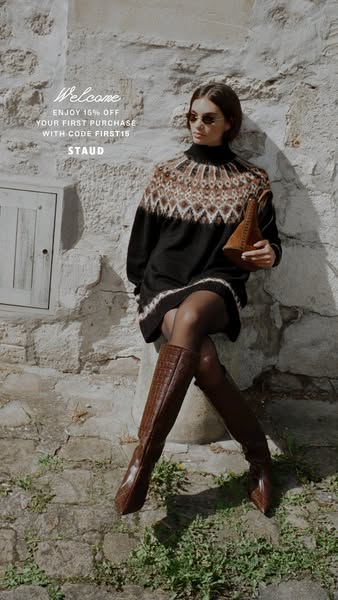 This image ad welcomes new customers with a discount code for 15% off their first purchase from the brand STAUD. The ad 