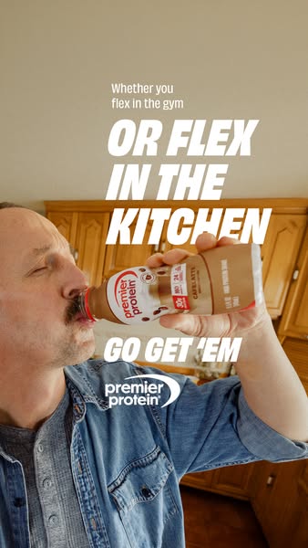 This image ad shows a man drinking a Premier Protein Cafe Latte shake in his kitchen. The ad uses humor to suggest that 