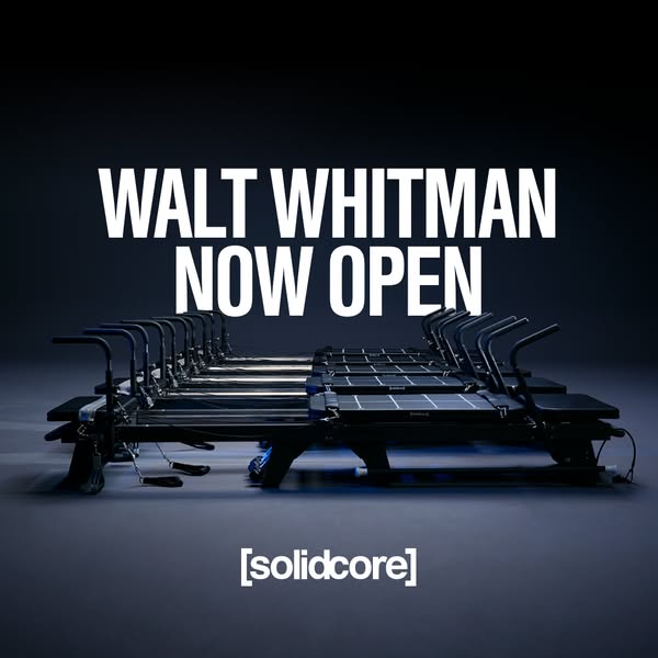 The ad features a sleek image of the [solidcore] workout machines and announces the opening of a new location in Walt Wh