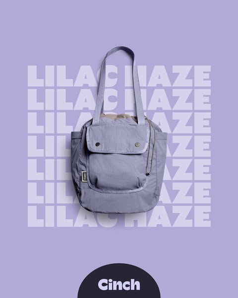 This is a static image ad featuring a lilac Cinch tote bag against a lilac background with the brand name prominently di