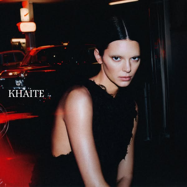 This image ad features a close-up of Kendall Jenner. She is looking at the camera in front of an out-of-focus city backg