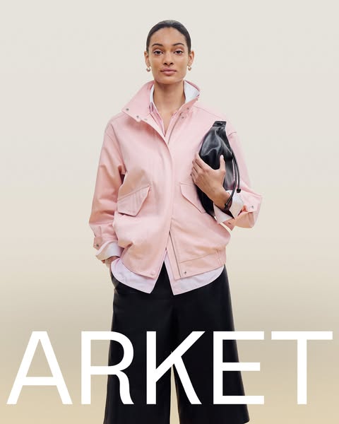 This ad features a woman wearing a pink jacket and holding a black bag, set against a gradient background. The brand nam