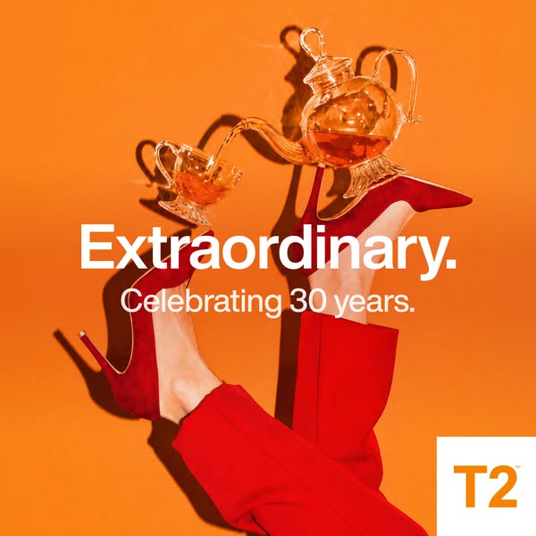 This ad is celebrating the 30 year anniversary of T2. The image shows the legs and feet of a model laying down and balan
