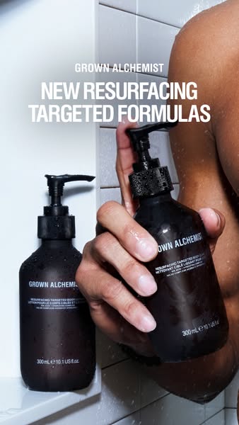 An image ad for Grown Alchemist features new resurfacing targeted formulas, displaying two dark brown pump bottles in a 