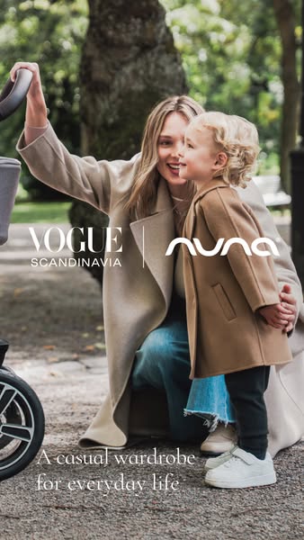 This image features a high-fashion collaboration between Vogue Scandinavia and Nuna baby products. The shot depicts a mo