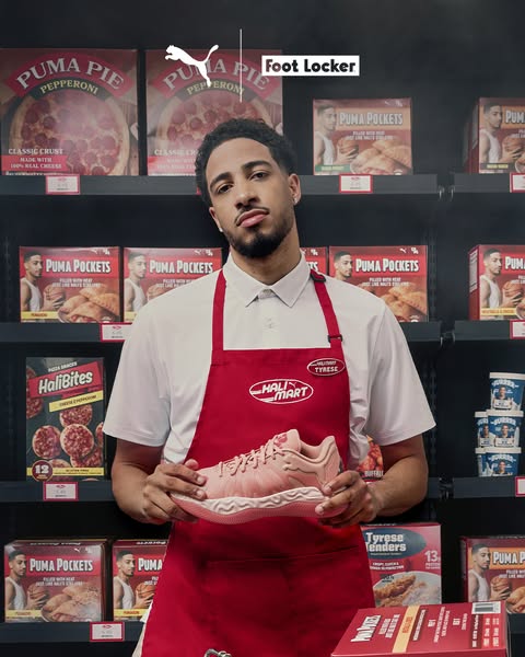 This ad features a man wearing a grocery store uniform while holding Puma sneakers, surrounded by Puma-branded frozen fo