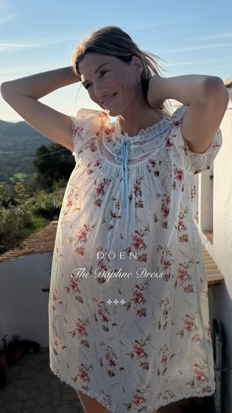 An image ad showcasing a model wearing a dress from the brand DOEN.