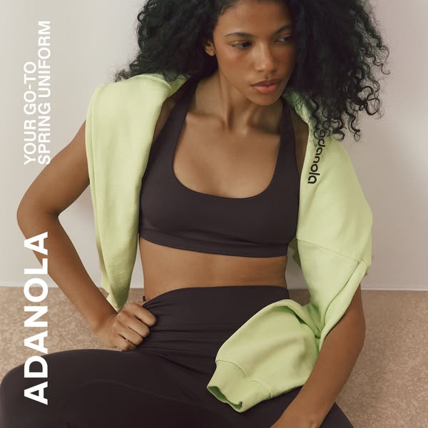 The Adanola ad features a person wearing their sports bra and leggings with a sweater tied around their shoulders. The a