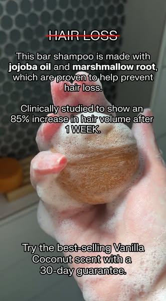 This ad promotes a bar shampoo made with jojoba oil and marshmallow root to help prevent hair loss. It highlights a clin