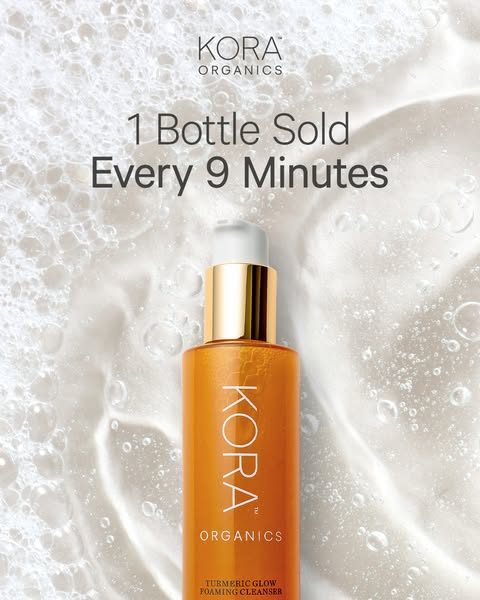 An ad that shows the Kora Organics Turmeric Glow Foaming Cleanser in front of a foamy background. The main message of th