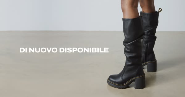 This ad features black heeled leather boots. The text overlay states that they are back in stock.