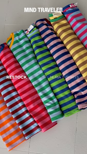The ad is showcasing Nuria T-shirts, which are colorful, striped T-shirts. The ad indicates that the T-shirts are back i