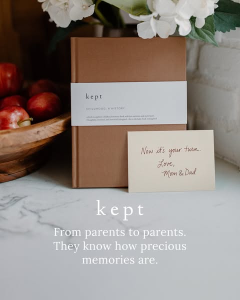 This ad promotes Kept baby memory books, showcasing the product against a cozy, neutral-toned backdrop to appeal to new 