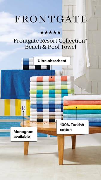 This image ad for Frontgate features stacks of the company's Resort Collection Beach & Pool Towels on a wooden t