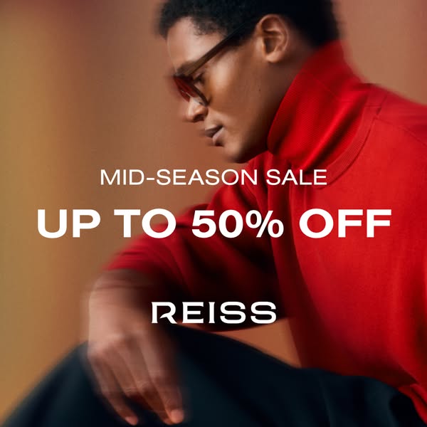 This Reiss ad promotes a mid-season sale with up to 50% off. It features a stylish man wearing a red turtleneck, hinting