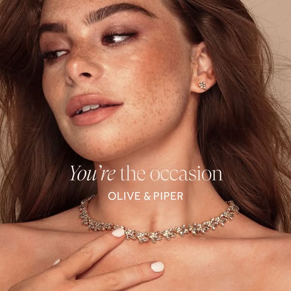This ad showcases Olive & Piper jewelry, specifically a necklace and earrings, worn by a model. The ad's primary
