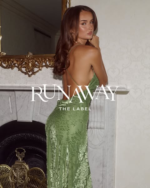 This ad for Runaway the Label features a woman in a green floral dress posing in front of a marble fireplace with the br