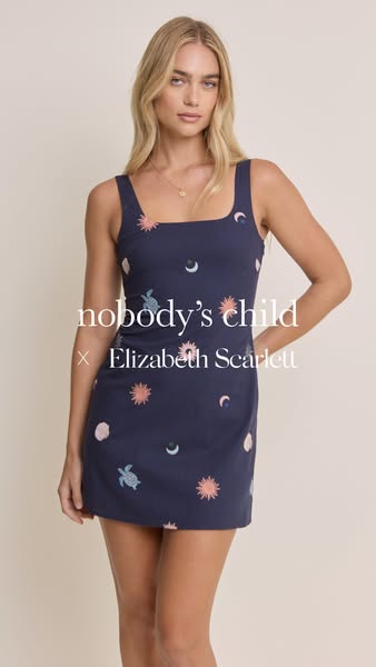 This ad features an image of a woman wearing a navy blue dress with a pattern of celestial objects. The text overlay ind