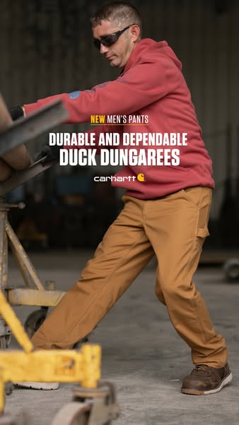 This ad showcases Carhartt's new durable and dependable duck dungarees for men. It shows a man working while wearing