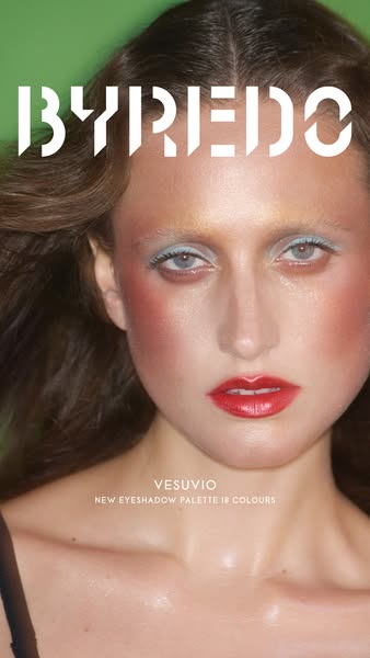 A close-up of a woman with makeup done using the VESUVIO eyeshadow palette.