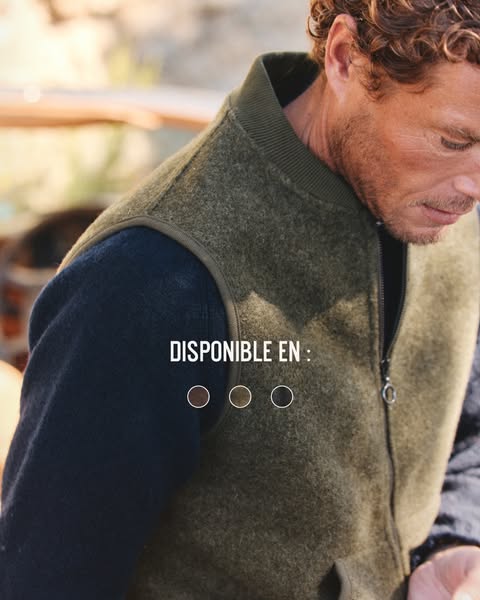 This image ad showcases a vest. It features a close-up shot of a man wearing the vest. The ad copy indicates the colors 