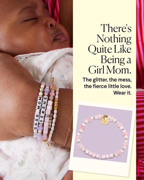 This ad features an image of a baby resting on an adult's arm wearing various beaded bracelets that spell out words 