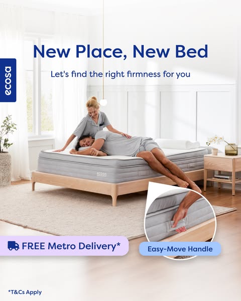 The ad shows a mattress on a bed frame, and a woman in pajamas adjusts the pillow while a man is lying on the bed. Text 