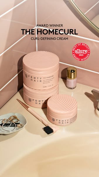 This ad showcases Fenty Hair's The Homecurl Curl-Defining Cream, highlighting its award-winning status and promoting