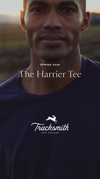 This ad features a close-up shot of a male athlete wearing a navy tee shirt with the brand and product name. The text ov