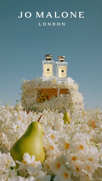 This image ad showcases two Jo Malone fragrances with a creative composition of a van covered in white flowers and a pea