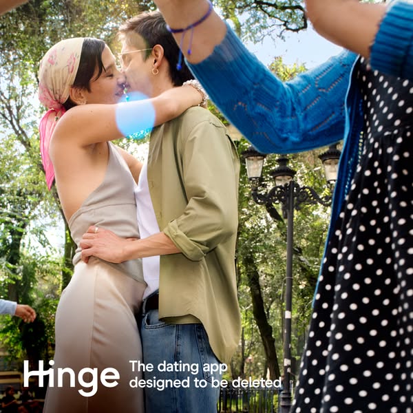 This image ad for Hinge features a couple kissing in a park-like setting with the tagline, 'The dating app designed 