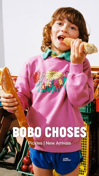 This ad promotes Bobo Choses' new arrivals in their Pickles line featuring a child model eating a baguette, dressed 