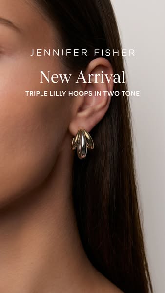 This is an image ad showcasing the Triple Lilly Hoops in Two Tone from Jennifer Fisher. The ad features a close-up shot 
