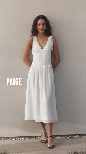 This ad features an image of a woman wearing a long white dress. The brand name is written on the left side of the image