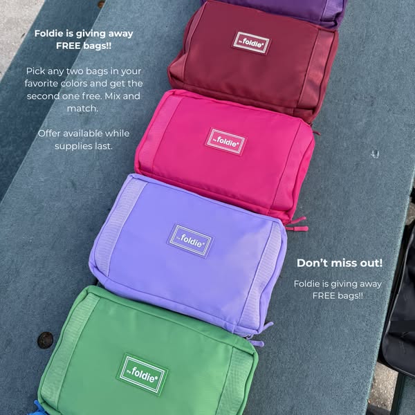 This image ad features a stack of Foldie bags in different colors. The ad announces that the company is giving away free