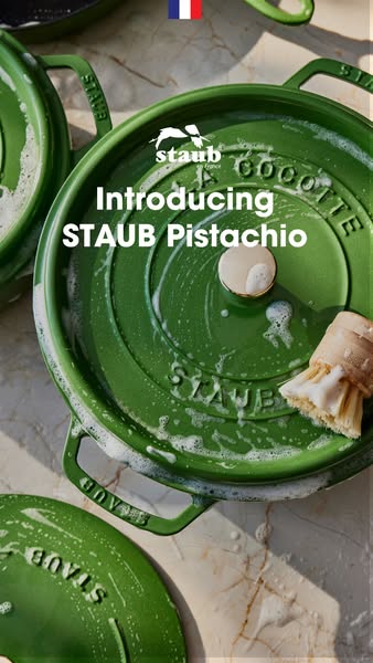A close-up shot of a green Staub cast iron pot and brush paired with the text 'Introducing STAUB Pistachio'.