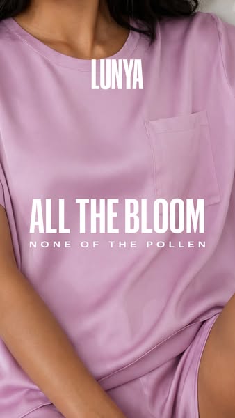 This ad is for Lunya sleepwear and features a close up view of a woman wearing a lavender-colored t-shirt and shorts set